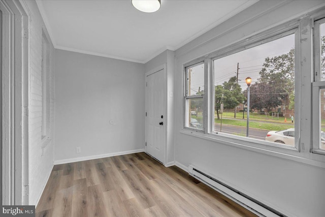 1528 Park Blvd, Camden, NJ 08103 - unfurnished room with baseboard heating, crown molding, and wood finished floors