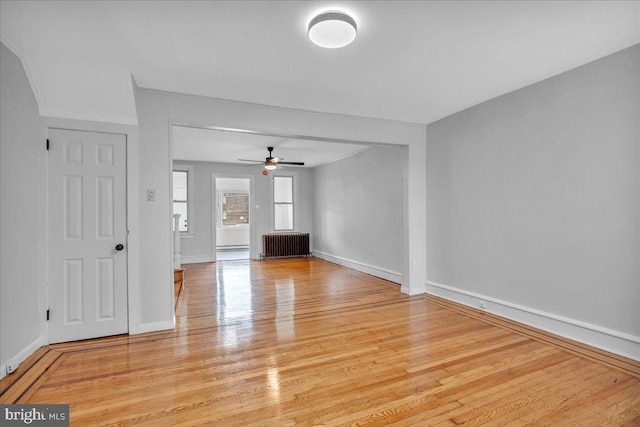 1528 Park Blvd, Camden, NJ 08103 - unfurnished living room featuring radiator heating unit, wood finished floors, a ceiling fan, and ornamental molding