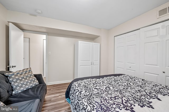 7702 Hanover Pkwy Unit 301, Greenbelt, MD 20770 - bedroom with wood finished floors and a closet