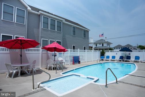 5600 Seaview Ave, Wildwood Crest, NJ 08260 - view of swimming pool featuring a fenced backyard, a patio, and a pool with connected hot tub