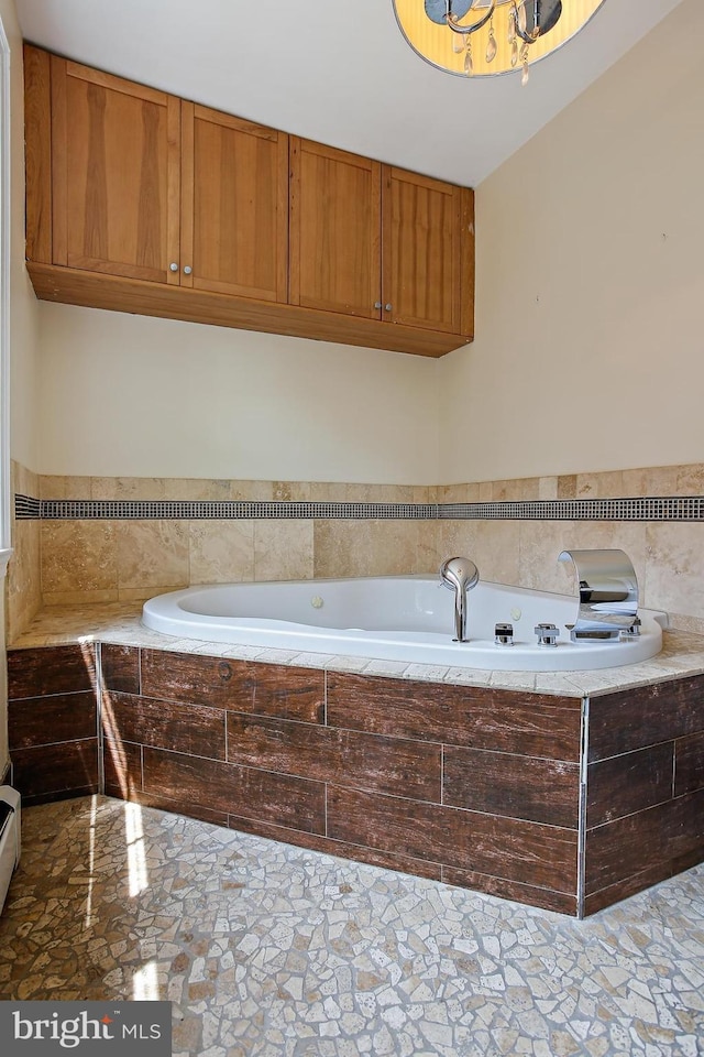 4713 Elsrode Ave, Baltimore, MD 21214 - bathroom featuring stone finish floors and a bath