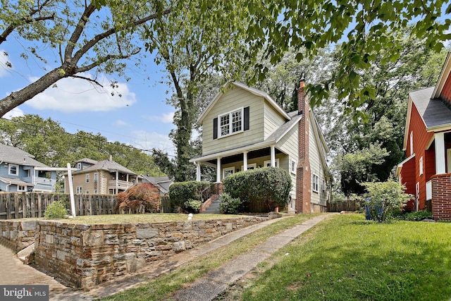 4713 Elsrode Ave, Baltimore, MD 21214 - view of front of house featuring a chimney and covered porch