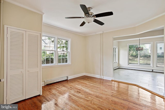 4713 Elsrode Ave, Baltimore, MD 21214 - unfurnished bedroom featuring a baseboard radiator, crown molding, wood finished floors, baseboard heating, and a ceiling fan