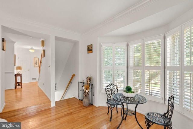 6498 Milva Ln, Springfield, VA 22150 - dining room featuring light wood-style floors, plenty of natural light, and crown molding