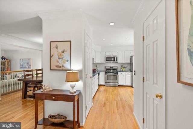 6498 Milva Ln, Springfield, VA 22150 - hallway featuring light wood finished floors, ornamental molding, and recessed lighting