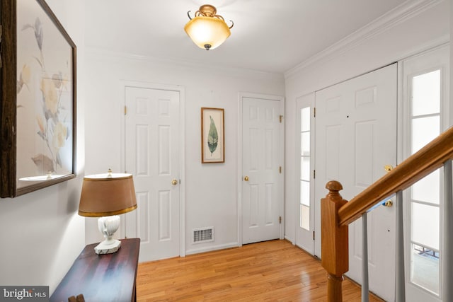 6498 Milva Ln, Springfield, VA 22150 - entrance foyer featuring healthy amount of natural light, light wood-style floors, and crown molding