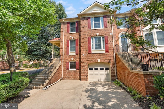 6498 Milva Ln, Springfield, VA 22150 - view of front of house with stairs, driveway, a garage, and brick siding