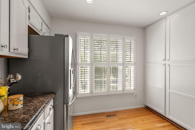 6498 Milva Ln, Springfield, VA 22150 - kitchen with stainless steel fridge with ice dispenser, light wood-style floors, plenty of natural light, white cabinetry, and recessed lighting