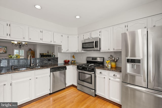 6498 Milva Ln, Springfield, VA 22150 - kitchen with stainless steel appliances, white cabinets, and recessed lighting