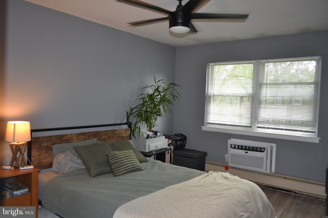4701 Pennell Rd Unit A-6, Aston, PA 19014 - bedroom featuring an AC wall unit, wood finished floors, and ceiling fan