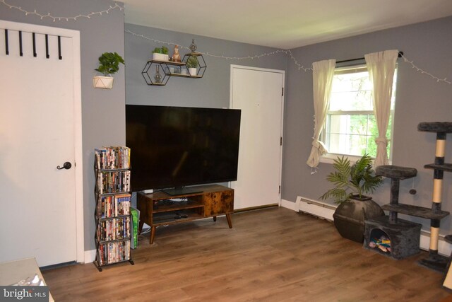 4701 Pennell Rd Unit A-6, Aston, PA 19014 - living area featuring a baseboard radiator and wood finished floors
