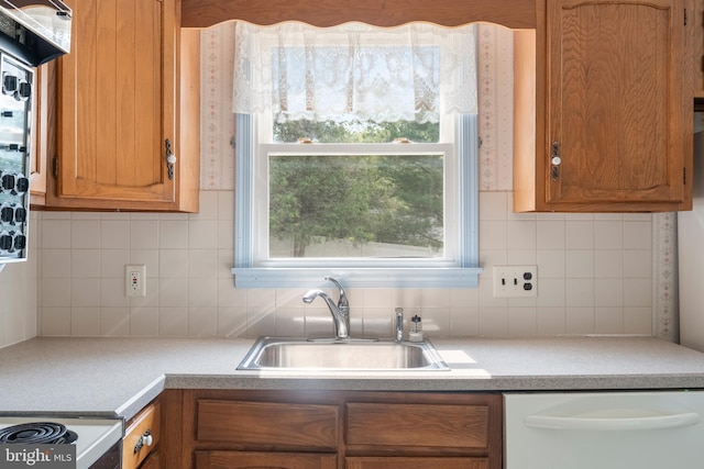330 N Liberty St, Coopersburg, PA 18036 - kitchen featuring white dishwasher, backsplash, and light countertops
