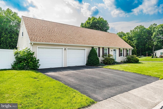 330 N Liberty St, Coopersburg, PA 18036 - cape cod home featuring asphalt driveway, a garage, and roof with shingles