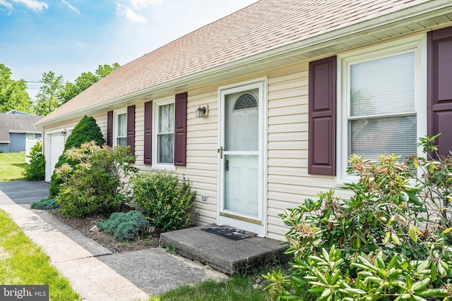 330 N Liberty St, Coopersburg, PA 18036 - entrance to property featuring roof with shingles and an attached garage