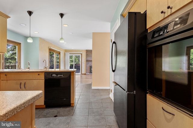 39 Haymarket Ln, Bryn Mawr, PA 19010 - kitchen with black appliances, healthy amount of natural light, decorative light fixtures, recessed lighting, and light countertops