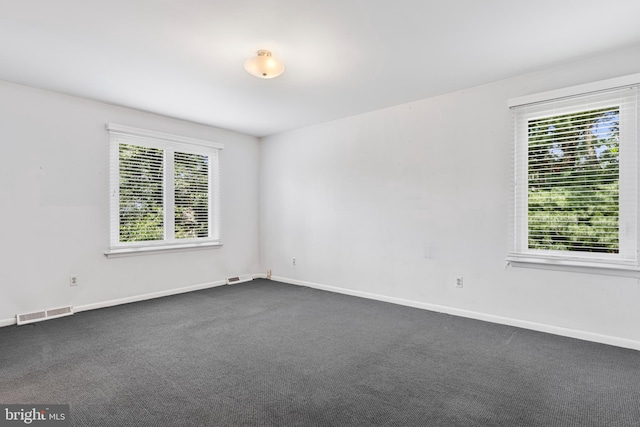 39 Haymarket Ln, Bryn Mawr, PA 19010 - spare room with plenty of natural light and dark colored carpet