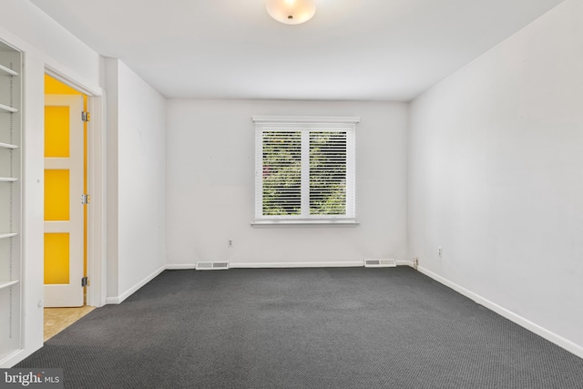 39 Haymarket Ln, Bryn Mawr, PA 19010 - unfurnished room with dark carpet and baseboards