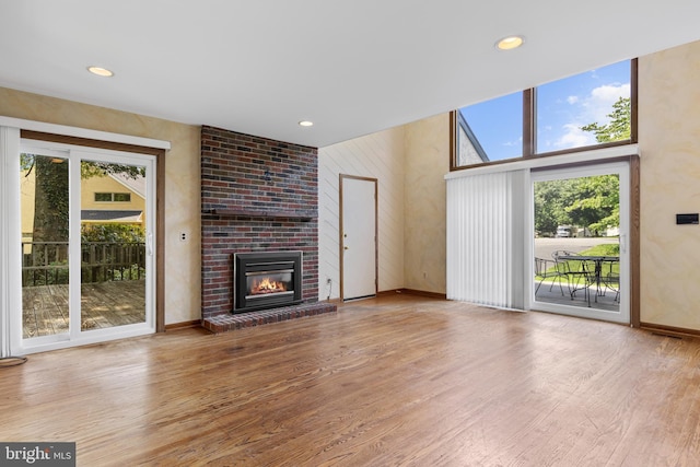 39 Haymarket Ln, Bryn Mawr, PA 19010 - unfurnished living room featuring wood finished floors, a fireplace, and recessed lighting