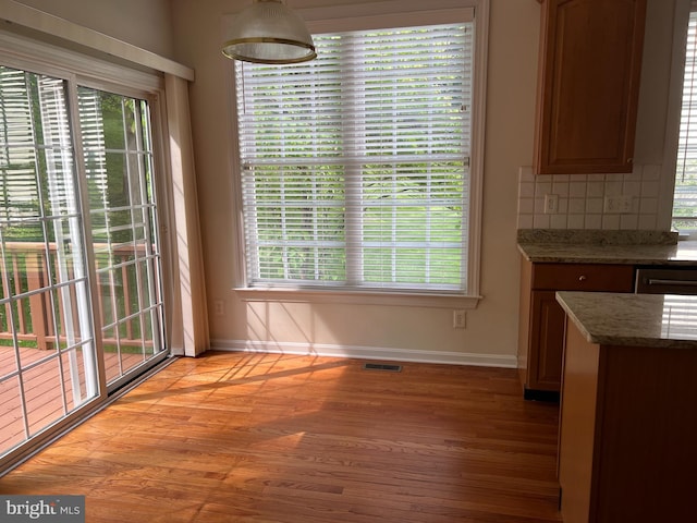 206 Excalibur Dr, Newtown Square, PA 19073 - unfurnished dining area with light wood-style floors and baseboards