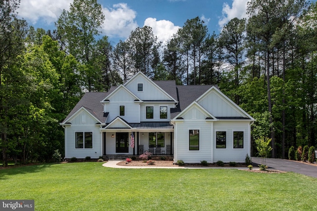 103 Wateredge Ln, Fredericksburg, VA 22406 - modern inspired farmhouse featuring a porch, board and batten siding, a front lawn, and a standing seam roof