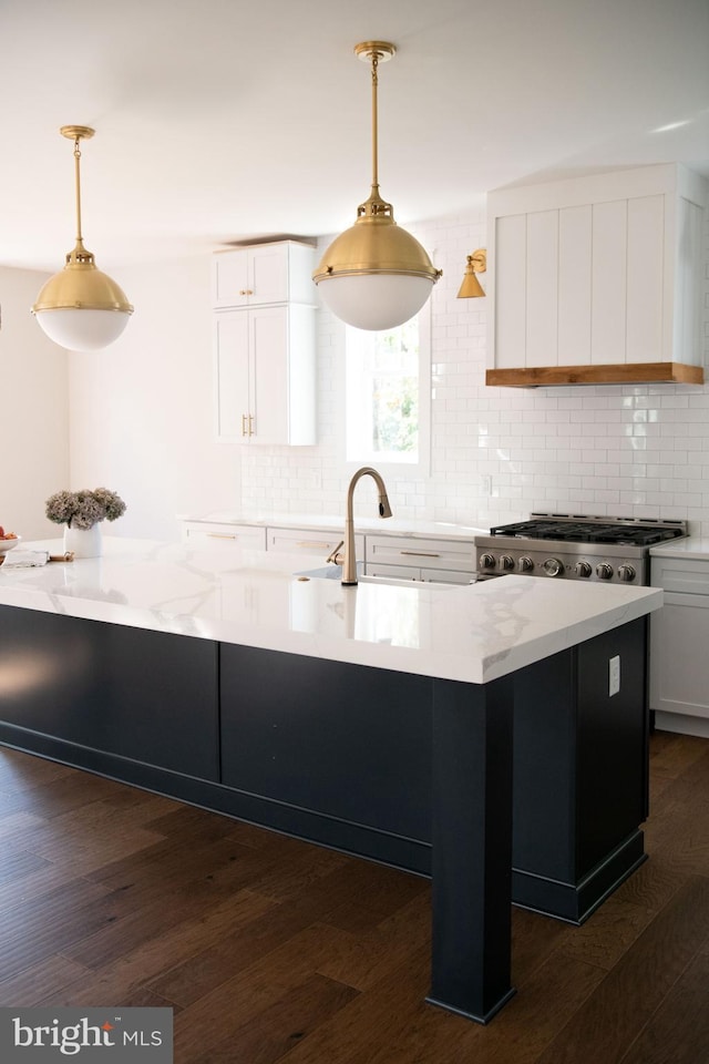 103 Wateredge Ln, Fredericksburg, VA 22406 - kitchen with decorative backsplash, stainless steel gas cooktop, dark wood-style flooring, and white cabinetry