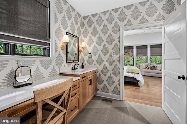 103 Wateredge Ln, Fredericksburg, VA 22406 - ensuite bathroom with wallpapered walls, vanity, ceiling fan, and plenty of natural light