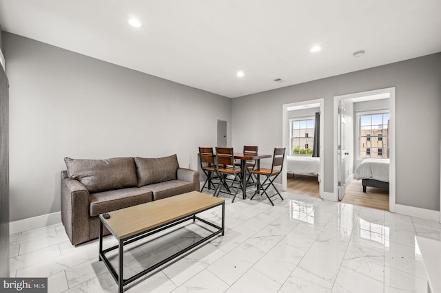 1719 W Norris St, Philadelphia, PA 19121 - living area with recessed lighting and light marble finish flooring