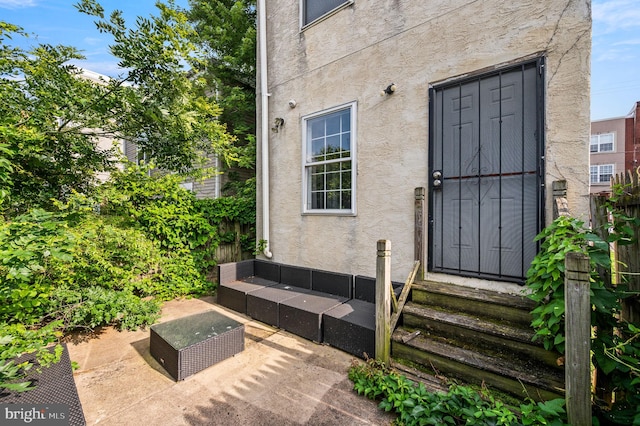 1719 W Norris St, Philadelphia, PA 19121 - property entrance featuring an outdoor living space, stucco siding, and a patio area