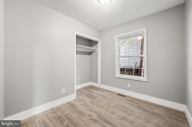 1719 W Norris St, Philadelphia, PA 19121 - unfurnished bedroom with wood finished floors and a closet