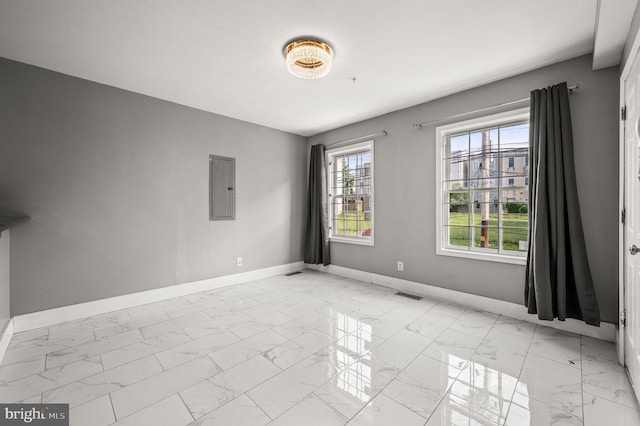 1719 W Norris St, Philadelphia, PA 19121 - spare room featuring electric panel and light marble finish flooring