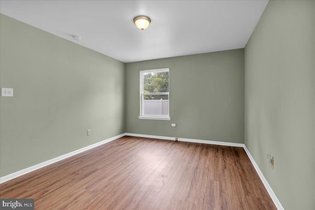 725 Logan Ave, Deptford, NJ 08096 - unfurnished room with wood finished floors and a smoke detector