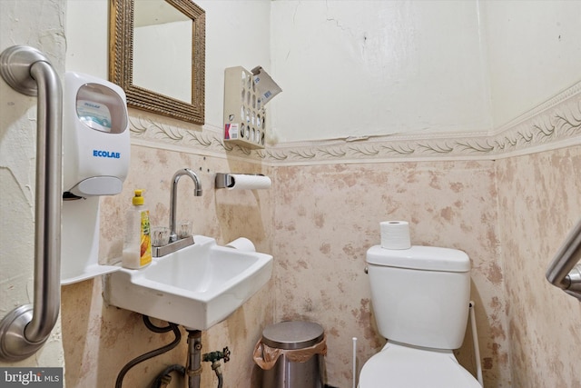 2945 Wharton St, Philadelphia, PA 19146 - bathroom featuring a sink and a wainscoted wall