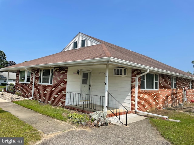 122 Elmtowne Blvd, Hammonton, NJ 08037 - view of front of property with brick siding, an AC wall unit, and roof with shingles
