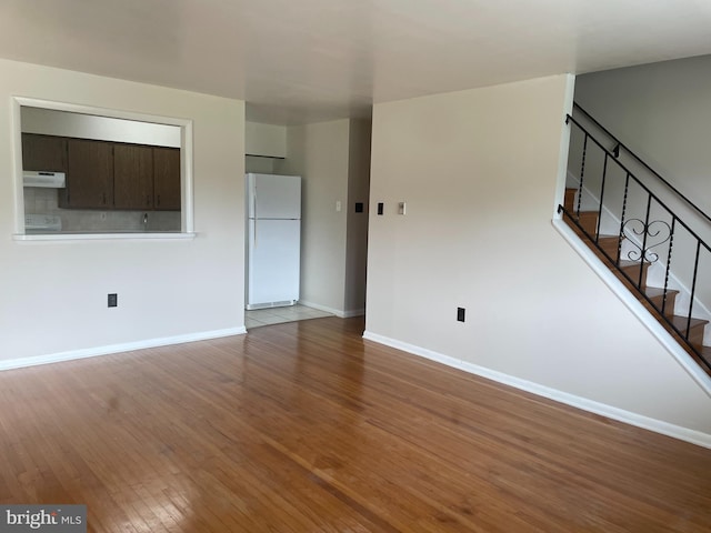 122 Elmtowne Blvd, Hammonton, NJ 08037 - unfurnished living room featuring wood finished floors and stairs