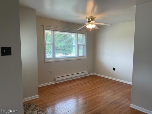 122 Elmtowne Blvd, Hammonton, NJ 08037 - empty room featuring a baseboard heating unit, wood finished floors, and a ceiling fan