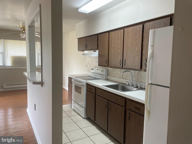 122 Elmtowne Blvd, Hammonton, NJ 08037 - kitchen featuring white appliances, under cabinet range hood, a baseboard heating unit, a ceiling fan, and decorative backsplash
