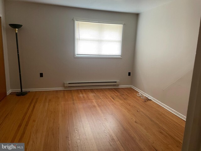 122 Elmtowne Blvd, Hammonton, NJ 08037 - unfurnished room with a baseboard radiator and light wood-style flooring
