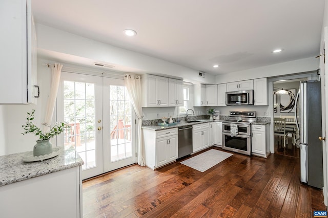 1632 Farm Brook Pl, Charlottesville, VA 22901 - kitchen featuring appliances with stainless steel finishes, white cabinetry, french doors, healthy amount of natural light, and recessed lighting