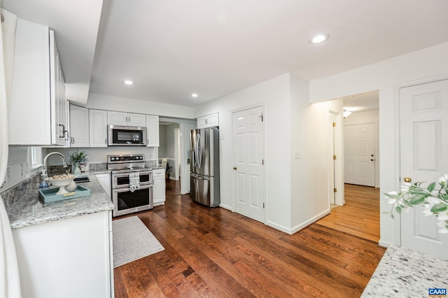 1632 Farm Brook Pl, Charlottesville, VA 22901 - kitchen with stainless steel appliances, dark wood-type flooring, white cabinets, recessed lighting, and light stone countertops