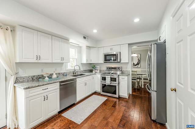 1632 Farm Brook Pl, Charlottesville, VA 22901 - kitchen featuring appliances with stainless steel finishes, dark wood-style flooring, recessed lighting, and white cabinets