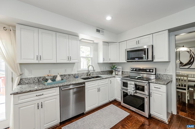 1632 Farm Brook Pl, Charlottesville, VA 22901 - kitchen featuring stainless steel appliances, white cabinets, dark wood-type flooring, recessed lighting, and light stone counters