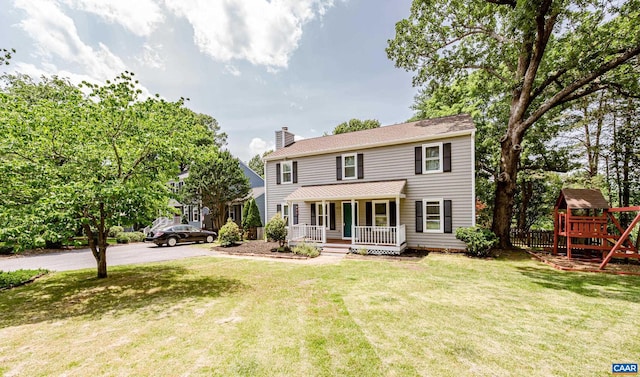 1632 Farm Brook Pl, Charlottesville, VA 22901 - colonial-style house with covered porch, a chimney, a front lawn, driveway, and a playground