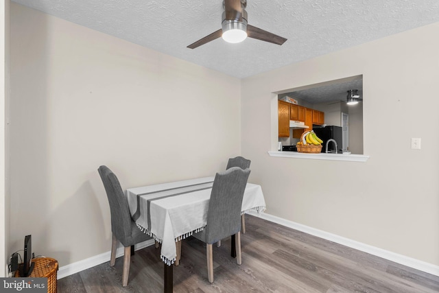 50 Amberstone Ct, Annapolis, MD 21403 - dining area featuring wood finished floors, a textured ceiling, and a ceiling fan