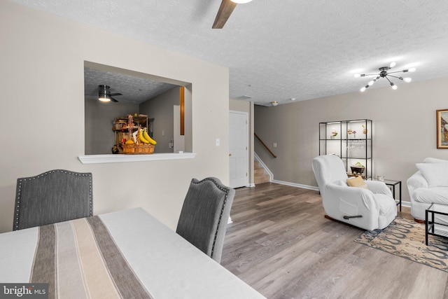50 Amberstone Ct, Annapolis, MD 21403 - dining area with wood finished floors, stairway, a textured ceiling, and ceiling fan