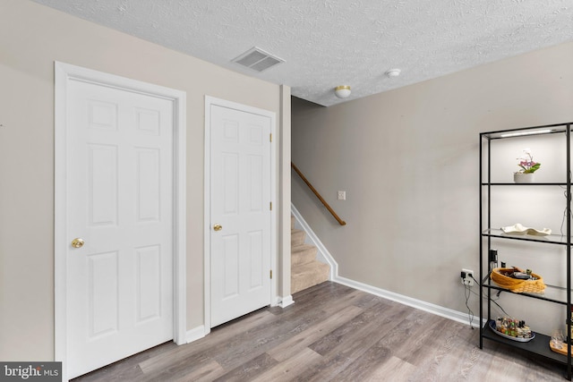 50 Amberstone Ct, Annapolis, MD 21403 - interior space with wood finished floors, stairway, and a textured ceiling