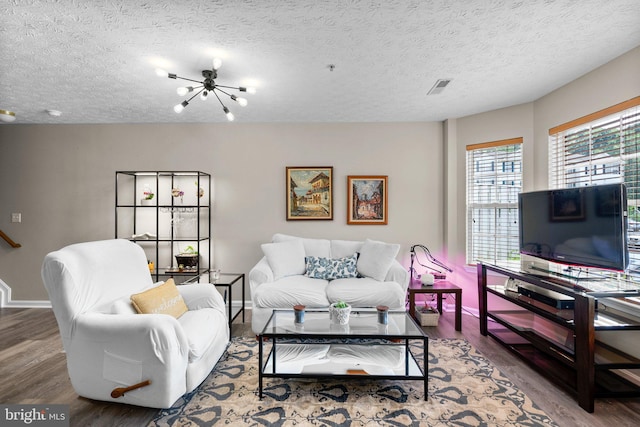 50 Amberstone Ct, Annapolis, MD 21403 - living area with wood finished floors, a textured ceiling, and a chandelier