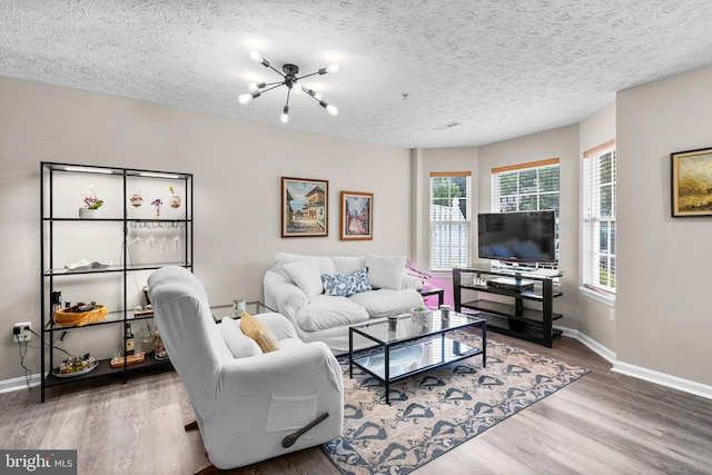 50 Amberstone Ct, Annapolis, MD 21403 - living room featuring wood finished floors, a chandelier, and a textured ceiling