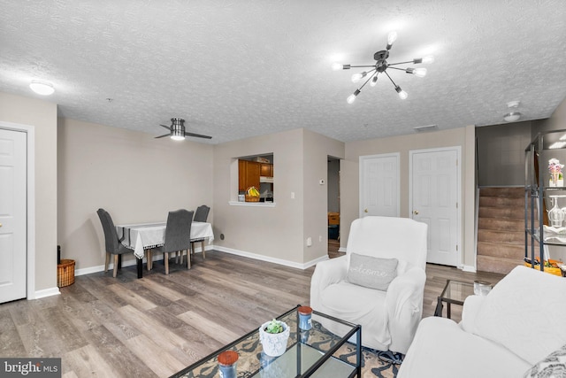 50 Amberstone Ct, Annapolis, MD 21403 - living area with stairway, wood finished floors, a chandelier, and a textured ceiling