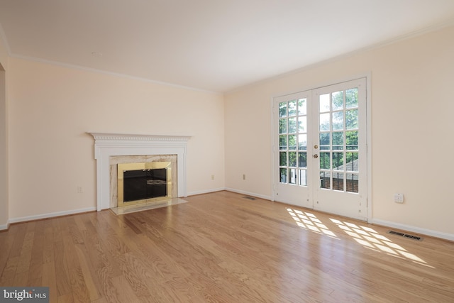 6708 Langston Blvd Unit A, Arlington, VA 22205 - unfurnished living room with wood finished floors, ornamental molding, french doors, and a high end fireplace