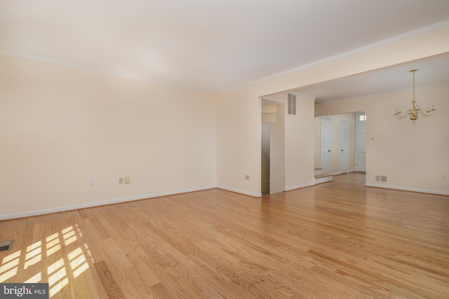 6708 Langston Blvd Unit A, Arlington, VA 22205 - unfurnished room featuring light wood-style floors, a chandelier, and ornamental molding